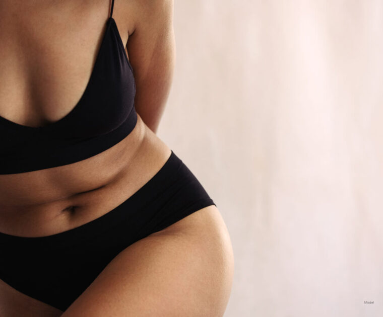 close up of woman's abs and hips wearing black underwear