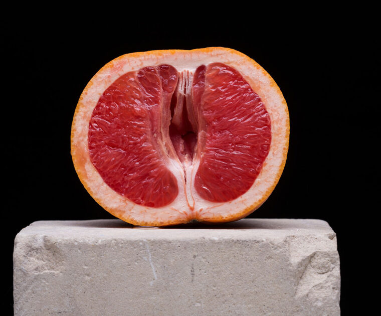 Blood orange cut in half; vagina concept